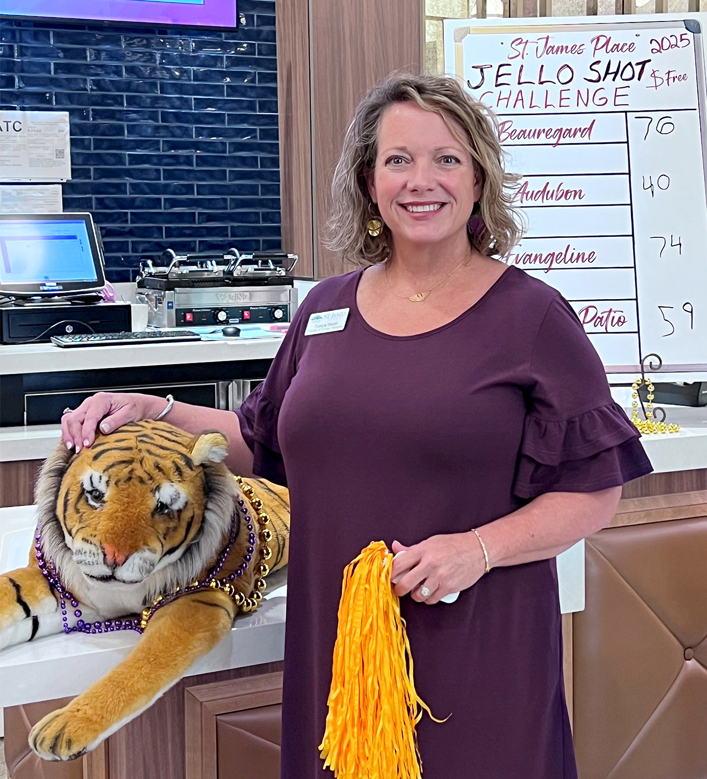 Tonya Dixon with Jell-O shot scoreboard and plush tiger