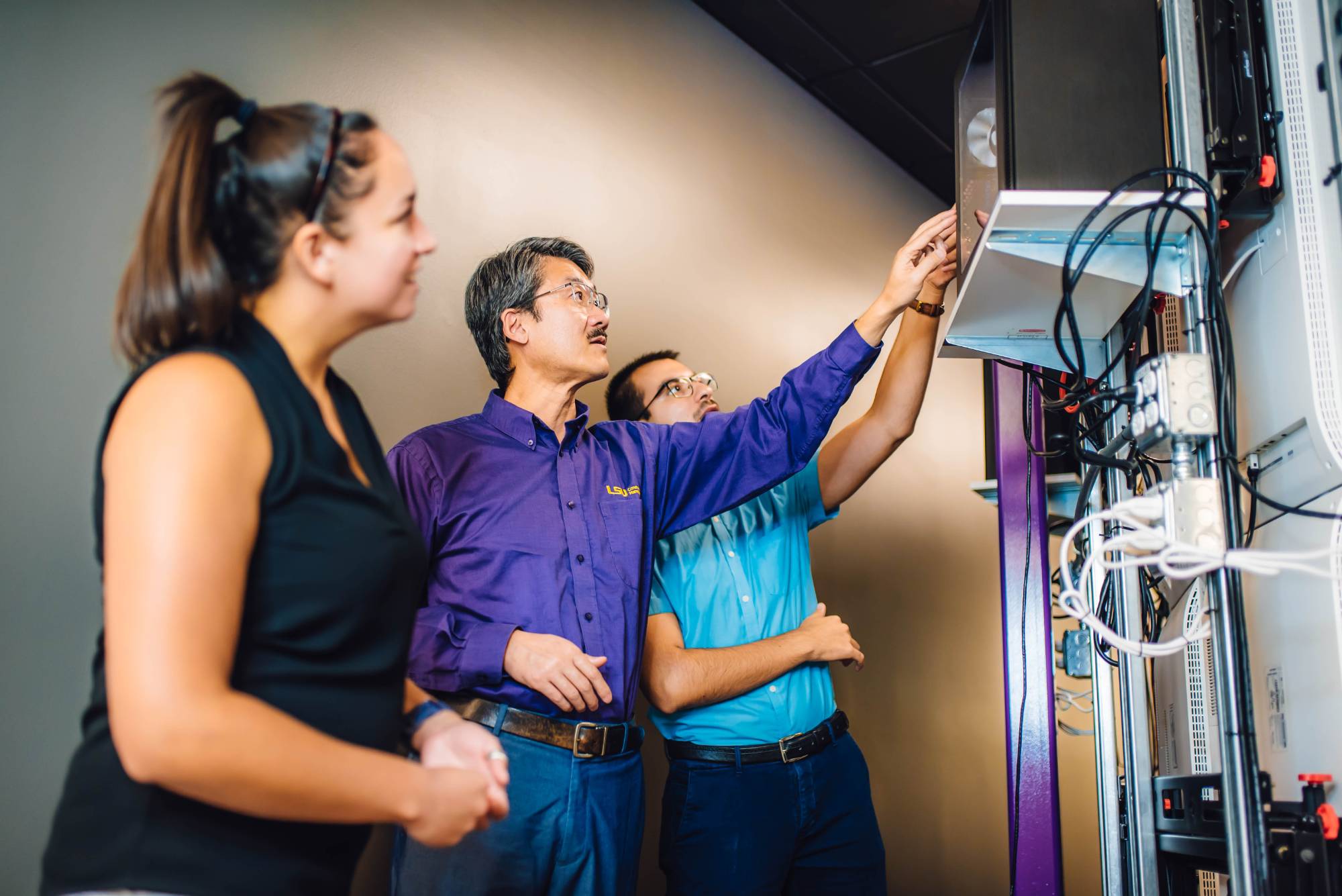 Construction management faculty member (middle) with students
