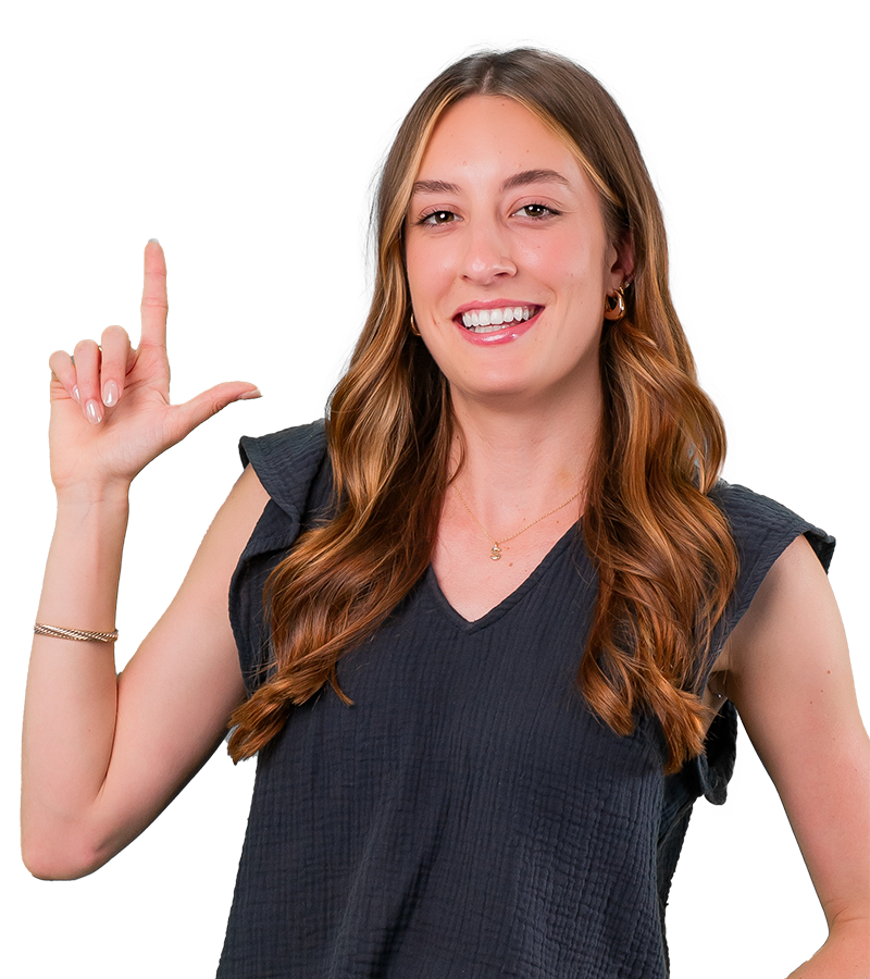 Svenya Stoyanoff is wearing a black shirt and holding her hand in the shape of an L