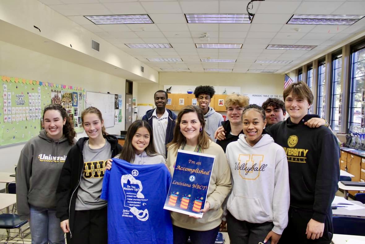 Teacher and students in the class posing for the camera